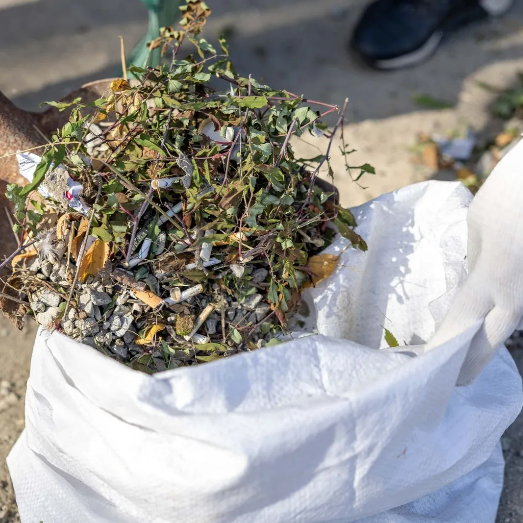 Clearing and bagging up debris